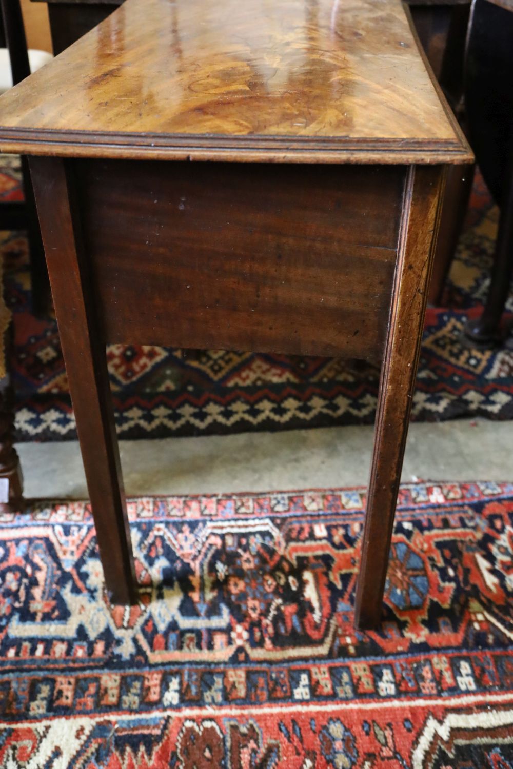 A George III mahogany low boy, housing one short and two long cockbeaded drawers, width 76cm, depth 46cm, height 72cm